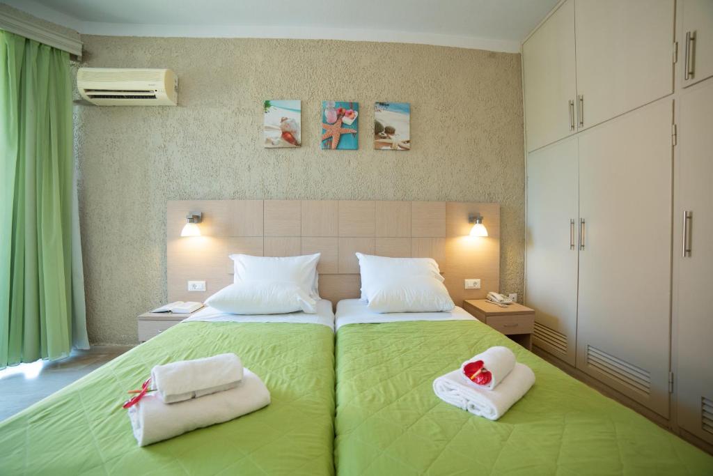 Postel nebo postele na pokoji v ubytování Hotel Alkionis