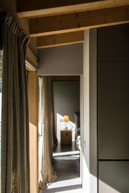 A bed or beds in a room at Vivere Suites & Rooms