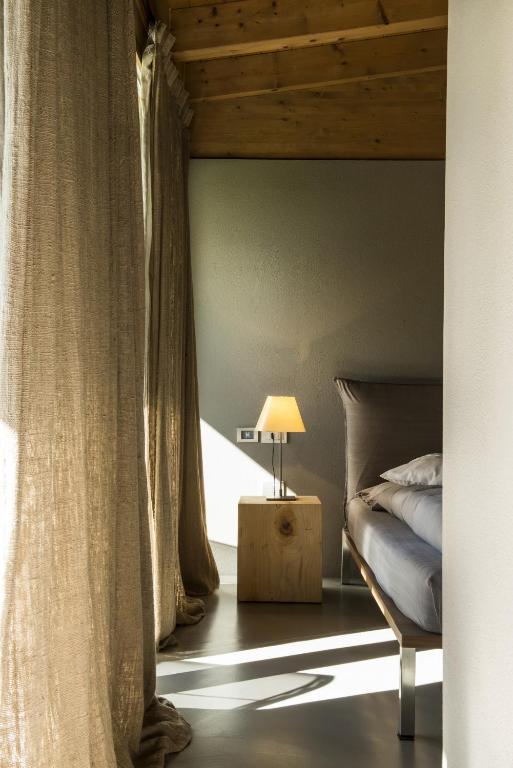 A bed or beds in a room at Vivere Suites & Rooms