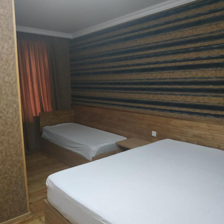 Postel nebo postele na pokoji v ubytování Mount Guest