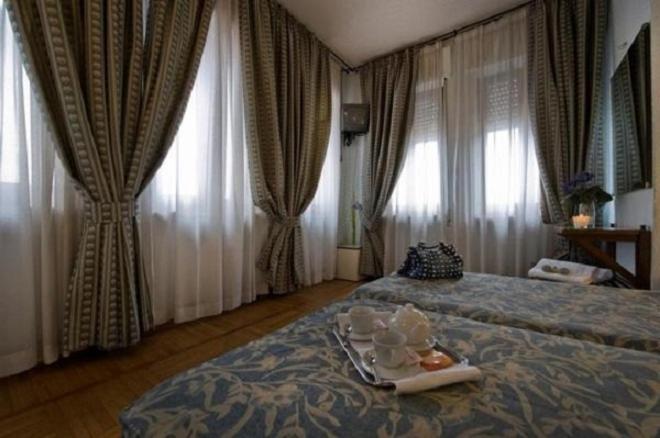 Cama ou camas em um quarto em Hotel Il Castello