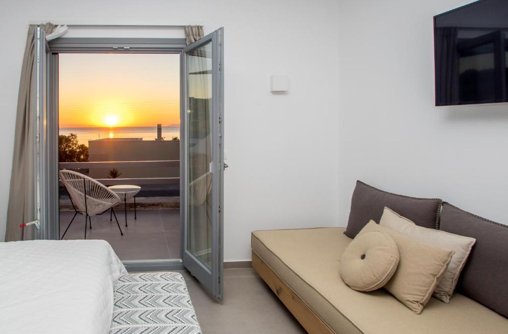 Postel nebo postele na pokoji v ubytování Oro Suites