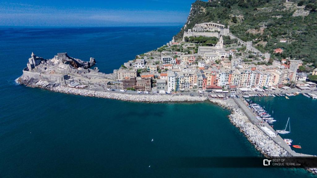 an aerial view of a town on an island in the water at affittacamere BABY in La Spezia