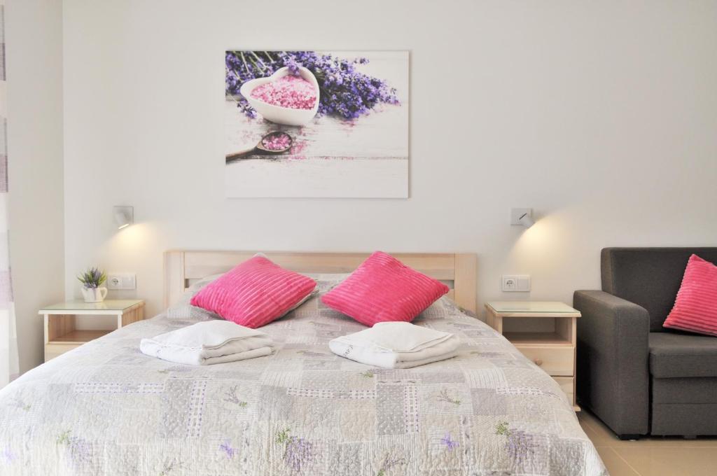 Postel nebo postele na pokoji v ubytování Apartamenty Feniks & Pegaz