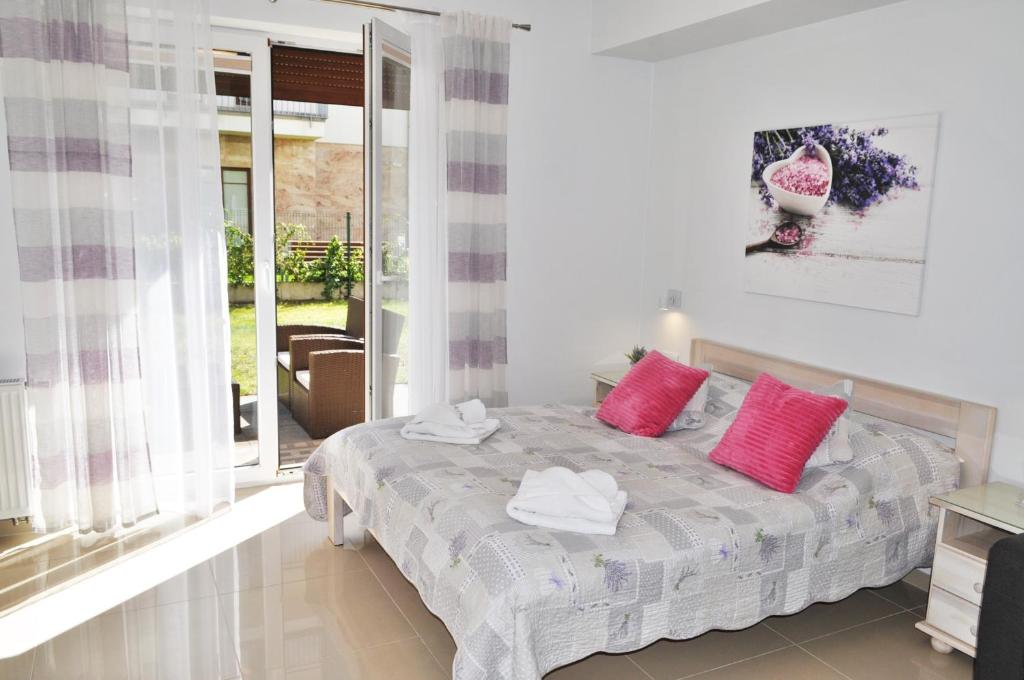 Postel nebo postele na pokoji v ubytování Apartamenty Feniks & Pegaz