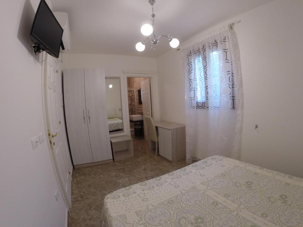 Postel nebo postele na pokoji v ubytování B&B Nonna Teresa