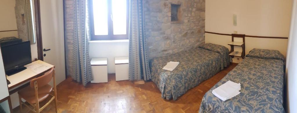 Uma TV ou centro de entretenimento em Hotel Il Castello
