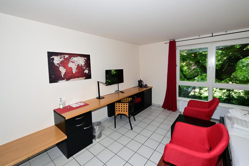 TV a/nebo společenská místnost v ubytování Art Hotel Weimar