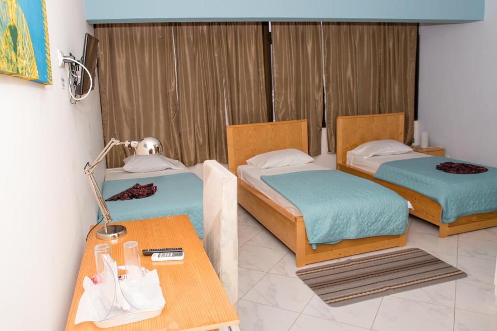Postel nebo postele na pokoji v ubytování LT Aparthotel