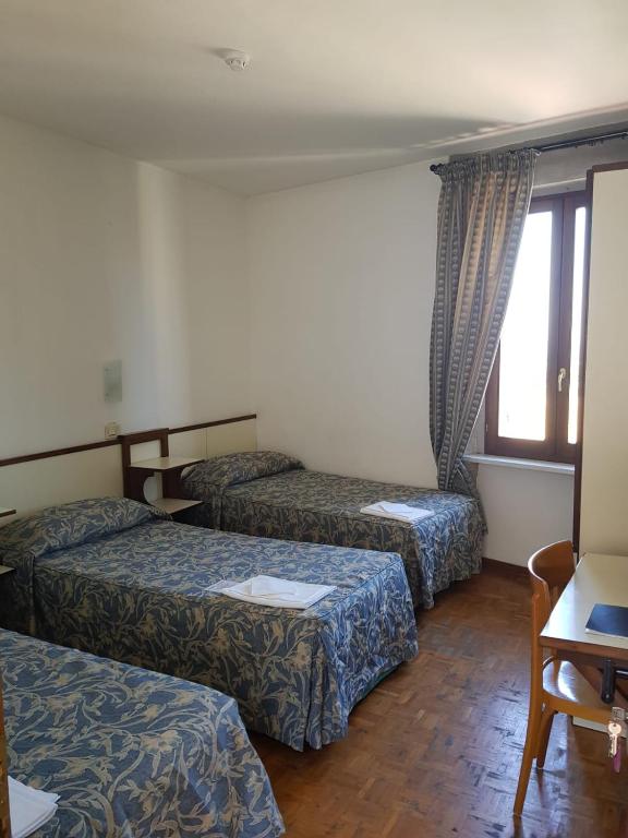 Cama ou camas em um quarto em Hotel Il Castello