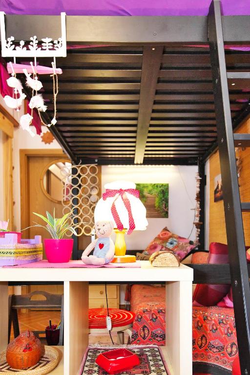 a bunk bed with a teddy bear sitting on a shelf at Apartments Baredi in Izola
