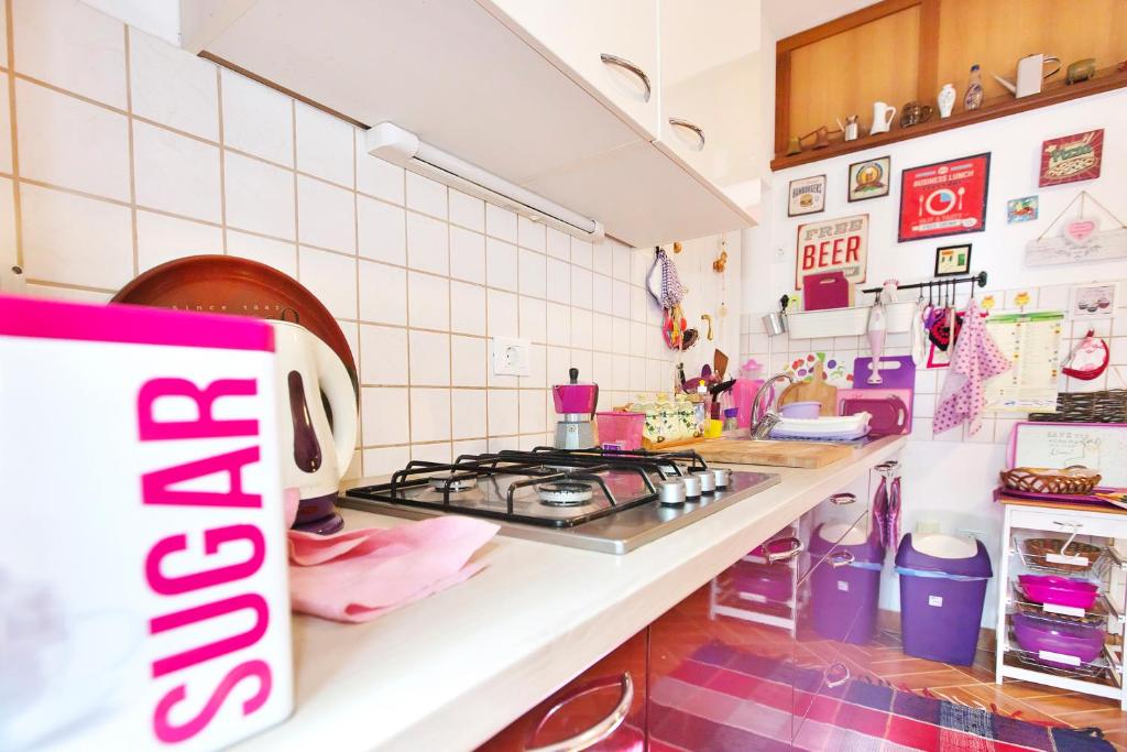 a kitchen with a stove and a counter top at Apartments Baredi in Izola