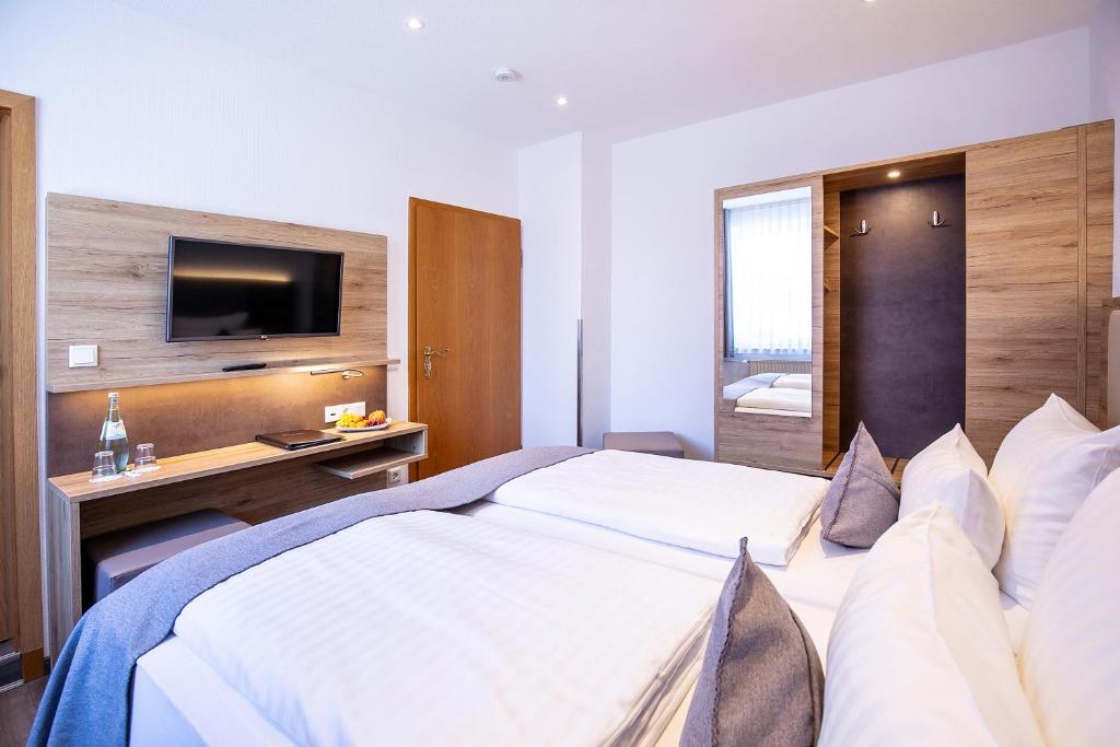 Postel nebo postele na pokoji v ubytování Landgasthof-Hotel Zum Steverstrand