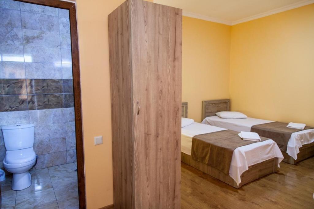 Voodi või voodid majutusasutuse Hotel Old Borjomi toas