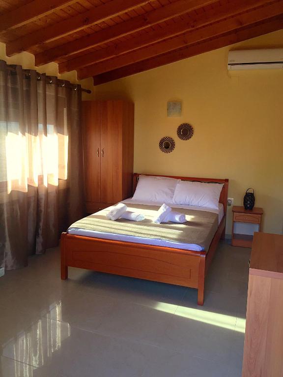 Postel nebo postele na pokoji v ubytování Villa Makri
