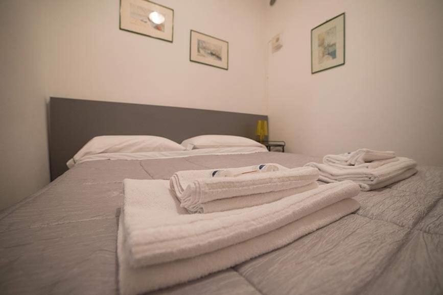 Postel nebo postele na pokoji v ubytování Camere Nicolina 3