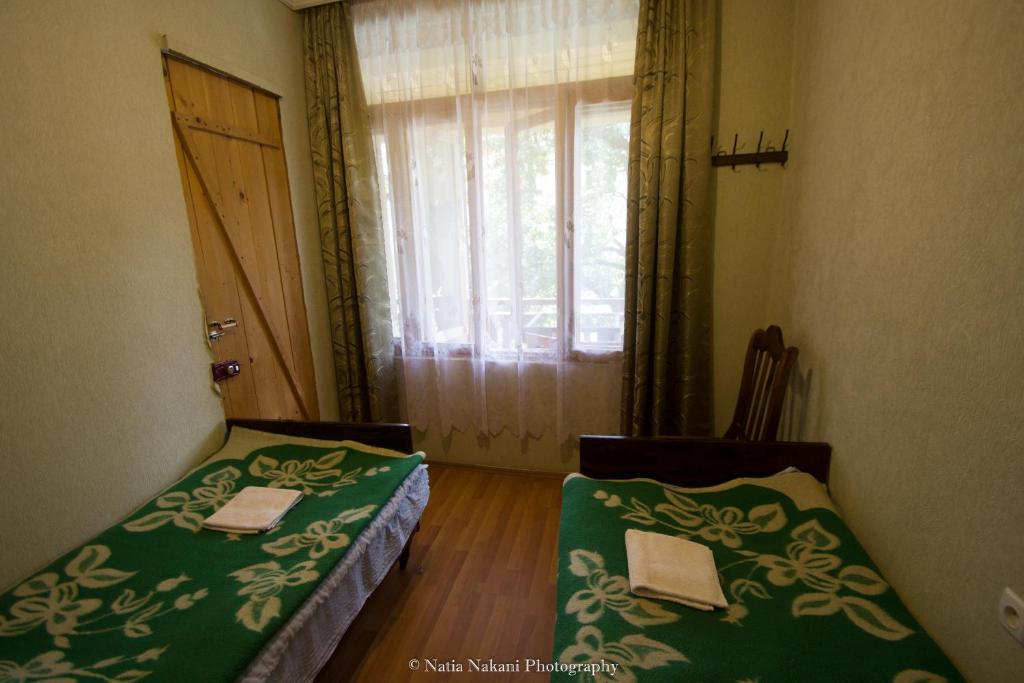 Postel nebo postele na pokoji v ubytování Eka&Nino GuestHouse