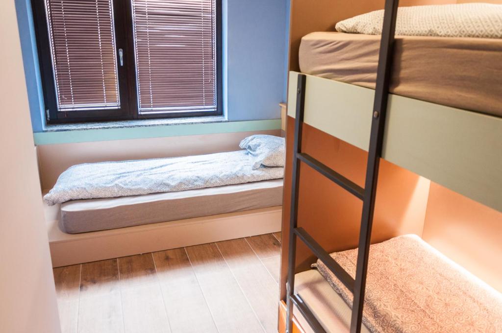 Postel nebo postele na pokoji v ubytování Ura Hostel