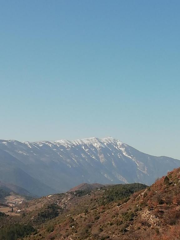 a snow covered mountain on top of a hill at LA MAGUETTE in Sault-de-Vaucluse