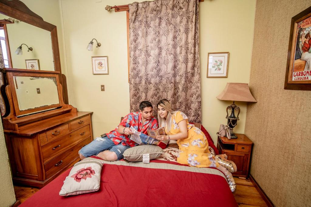 Postel nebo postele na pokoji v ubytování Hostal Aloha Inn