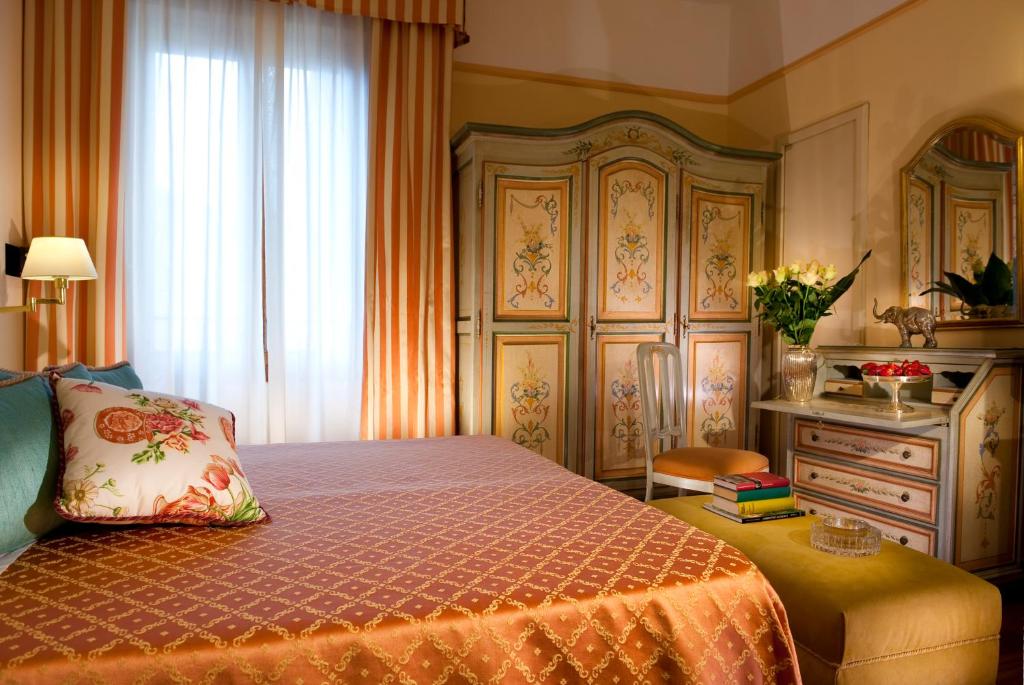 Postel nebo postele na pokoji v ubytování Hotel Parma e Oriente Wellness & Spa