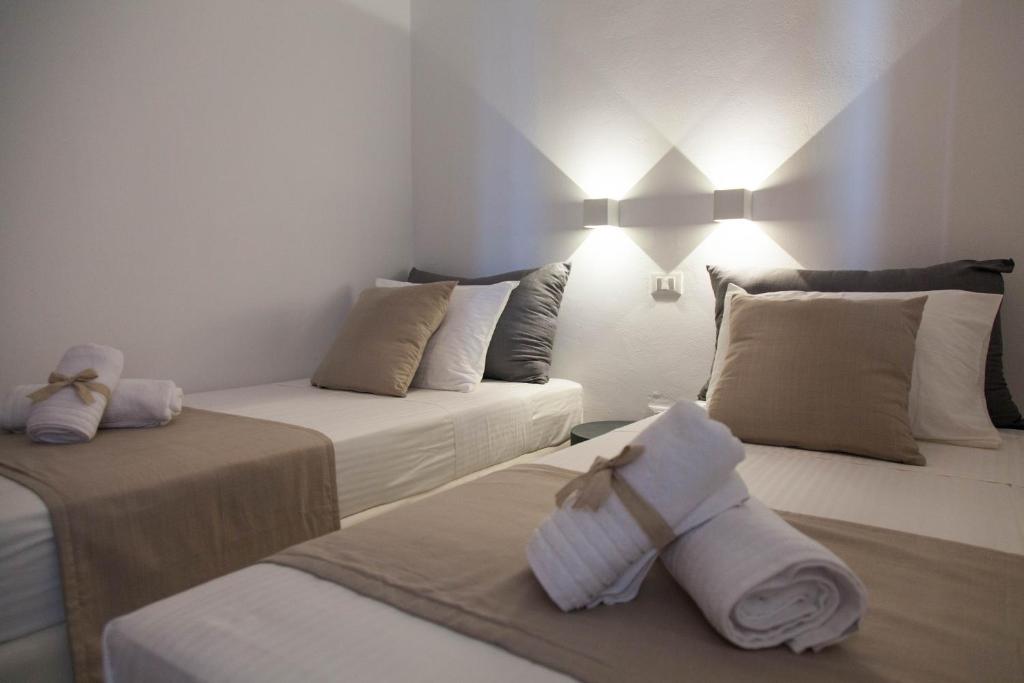 Кровать или кровати в номере Astarte Luxury Apartments