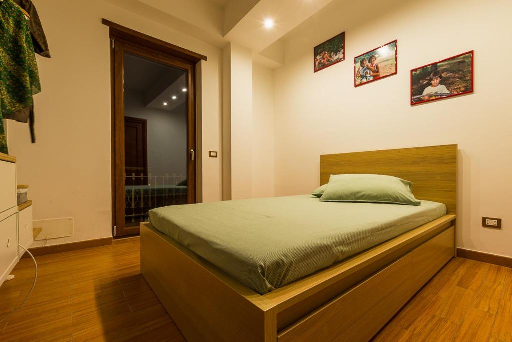 A bed or beds in a room at L'Approdo B&B