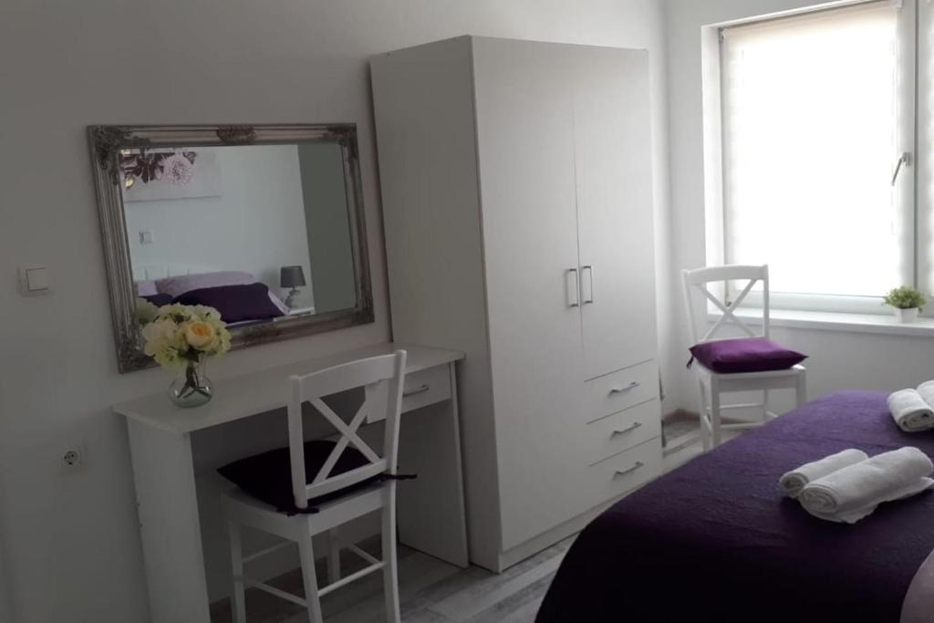 Postel nebo postele na pokoji v ubytování Apartman Lidija
