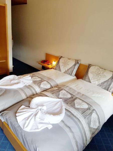 Postel nebo postele na pokoji v ubytování Albergo Posta