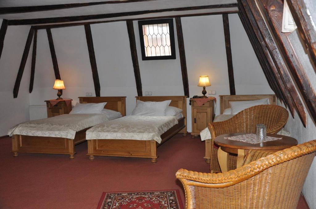Postel nebo postele na pokoji v ubytování Hotel Cerny Slon