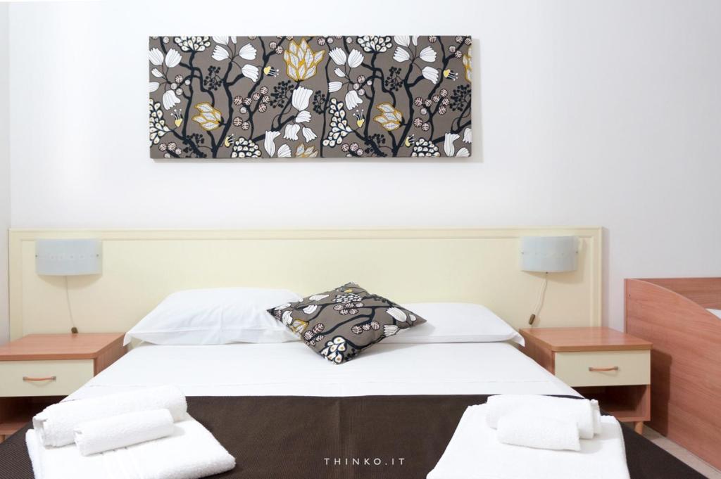 Postel nebo postele na pokoji v ubytování Hotel Universo