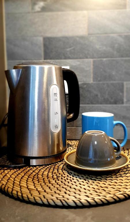 Příslušenství pro přípravu čaje a kávy v ubytování Loft4two