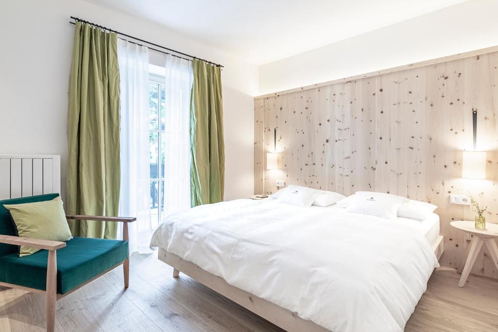 Postel nebo postele na pokoji v ubytování Hotel Drumlerhof