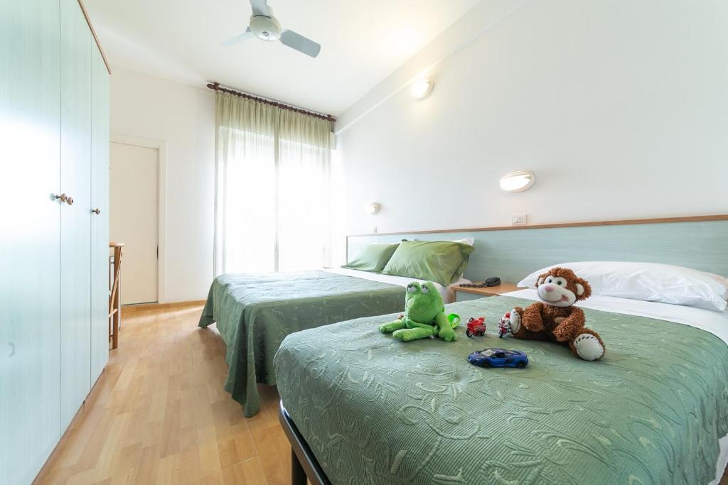 Postel nebo postele na pokoji v ubytování Hotel Augusta