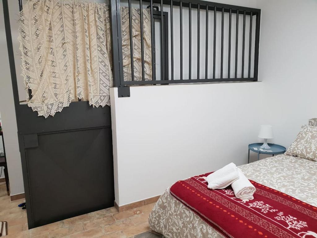 Postel nebo postele na pokoji v ubytování Suite le Scuderie a "le Moline" vita in fattoria