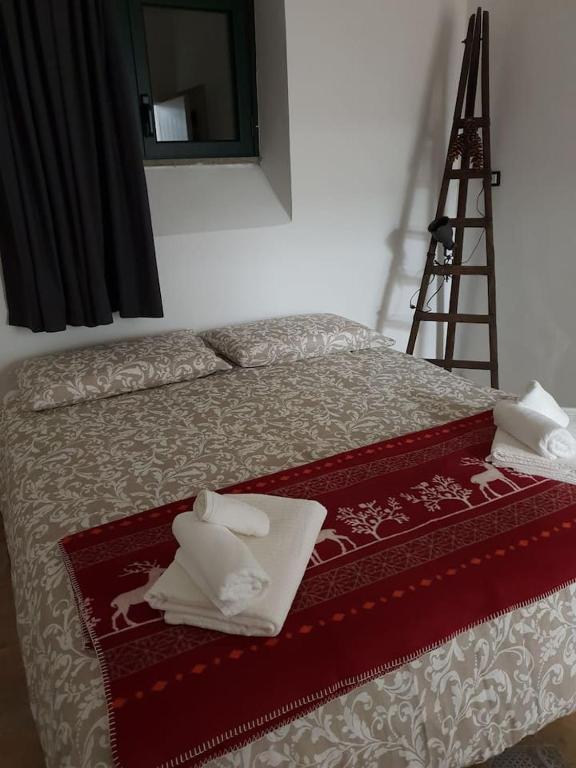 Postel nebo postele na pokoji v ubytování Suite le Scuderie a "le Moline" vita in fattoria