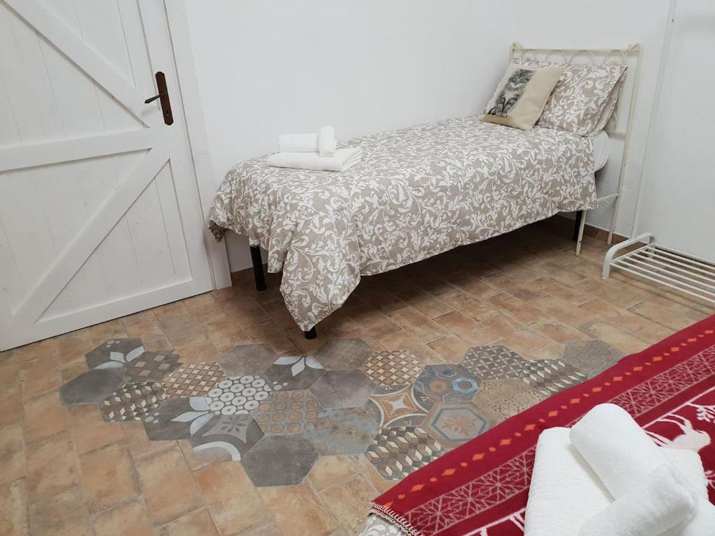 Postel nebo postele na pokoji v ubytování Suite le Scuderie a "le Moline" vita in fattoria