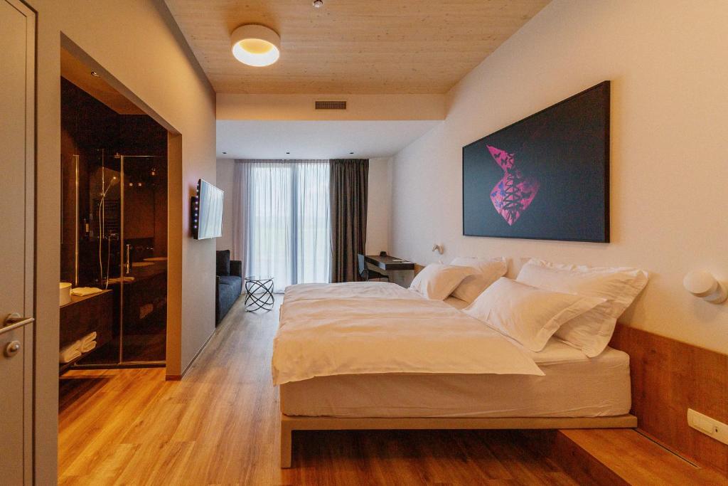 Postel nebo postele na pokoji v ubytování WUD hotel