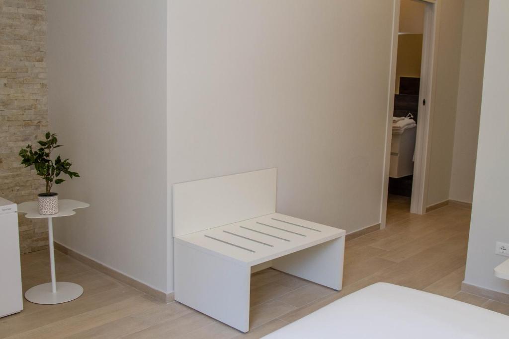 Postel nebo postele na pokoji v ubytování Le Suite del Corso