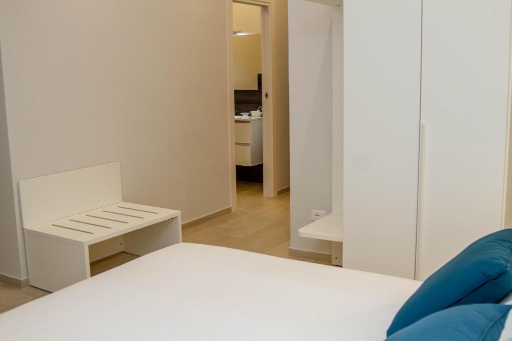 Postel nebo postele na pokoji v ubytování Le Suite del Corso