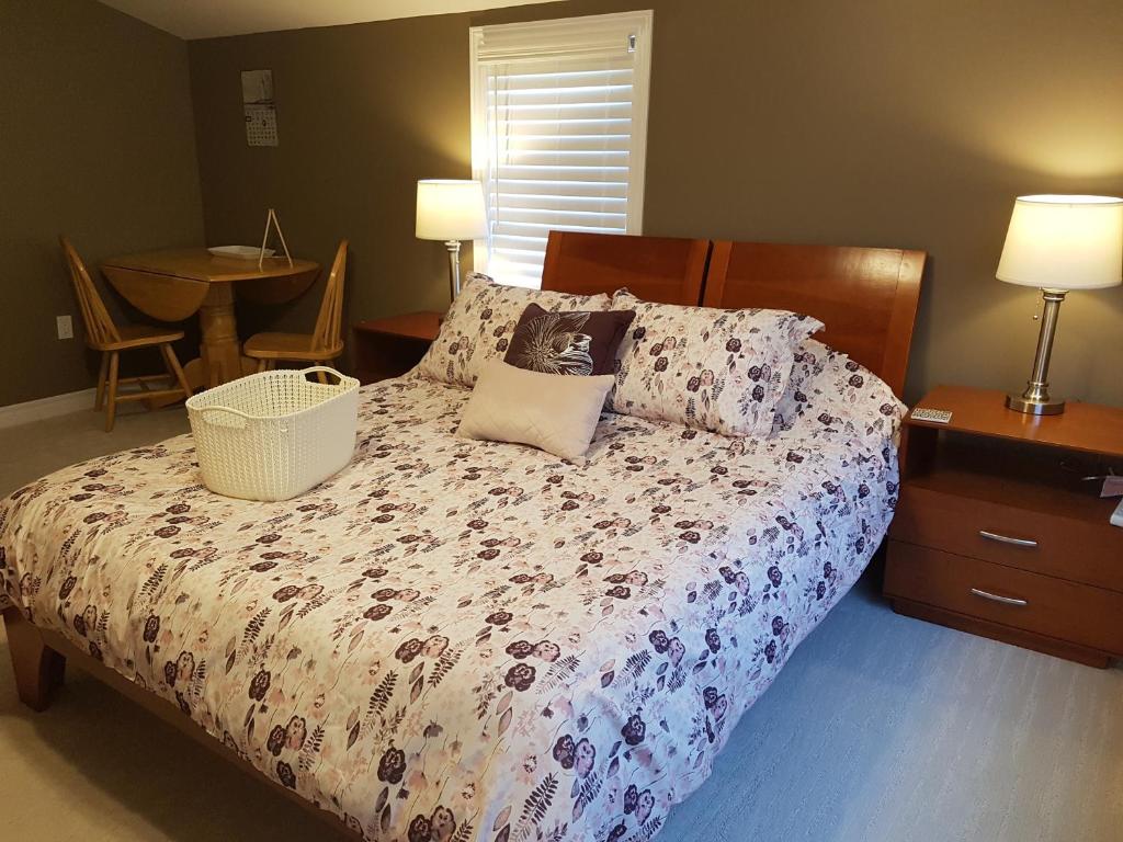 a bedroom with a bed and a table with chairs at Small Town Bound Inn in Montague