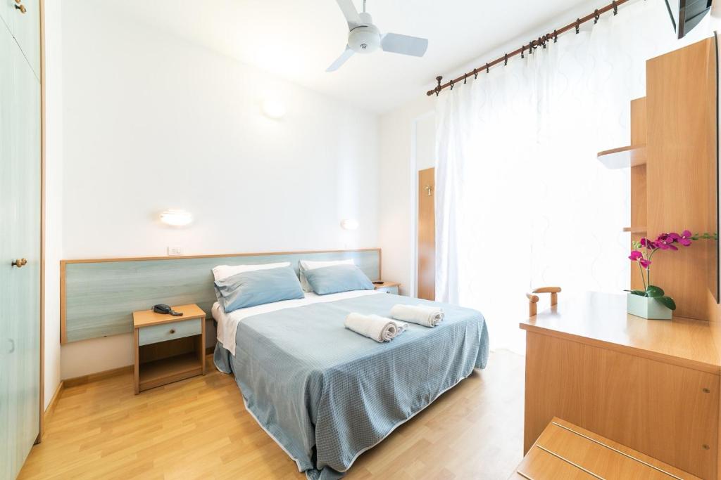 Postel nebo postele na pokoji v ubytování Hotel Augusta