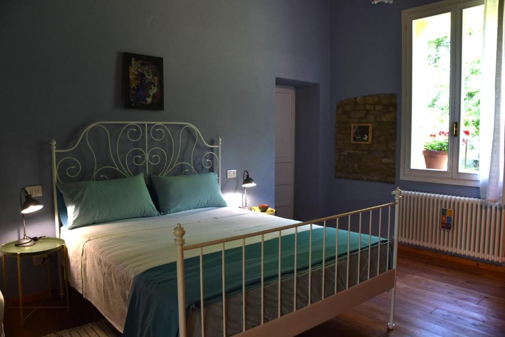 Casa delle ginestre tesisinde bir odada yatak veya yataklar