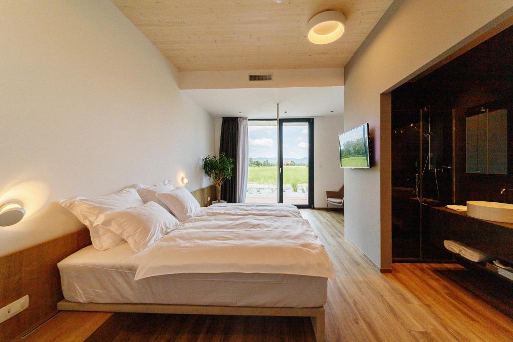 Postel nebo postele na pokoji v ubytování WUD hotel