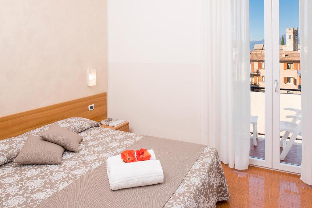 Postel nebo postele na pokoji v ubytování Hotel Taormina