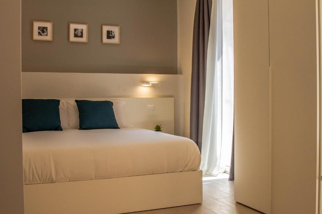 Postel nebo postele na pokoji v ubytování Le Suite del Corso