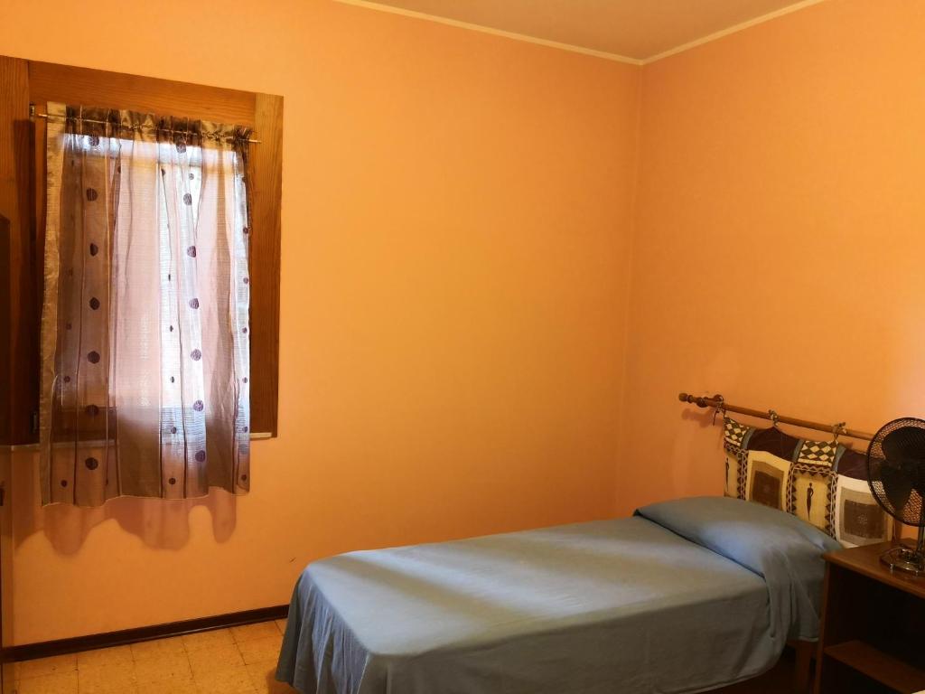 Postel nebo postele na pokoji v ubytování Trattoria Bar Oasi