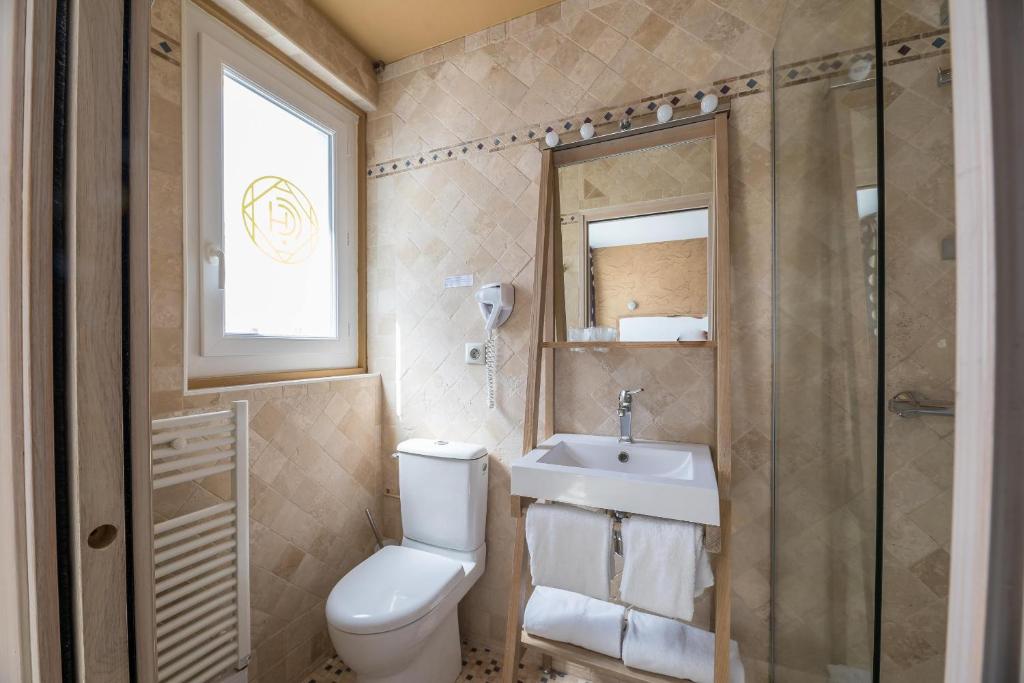Koupelna v ubytování Hôtel Cosmopolitain