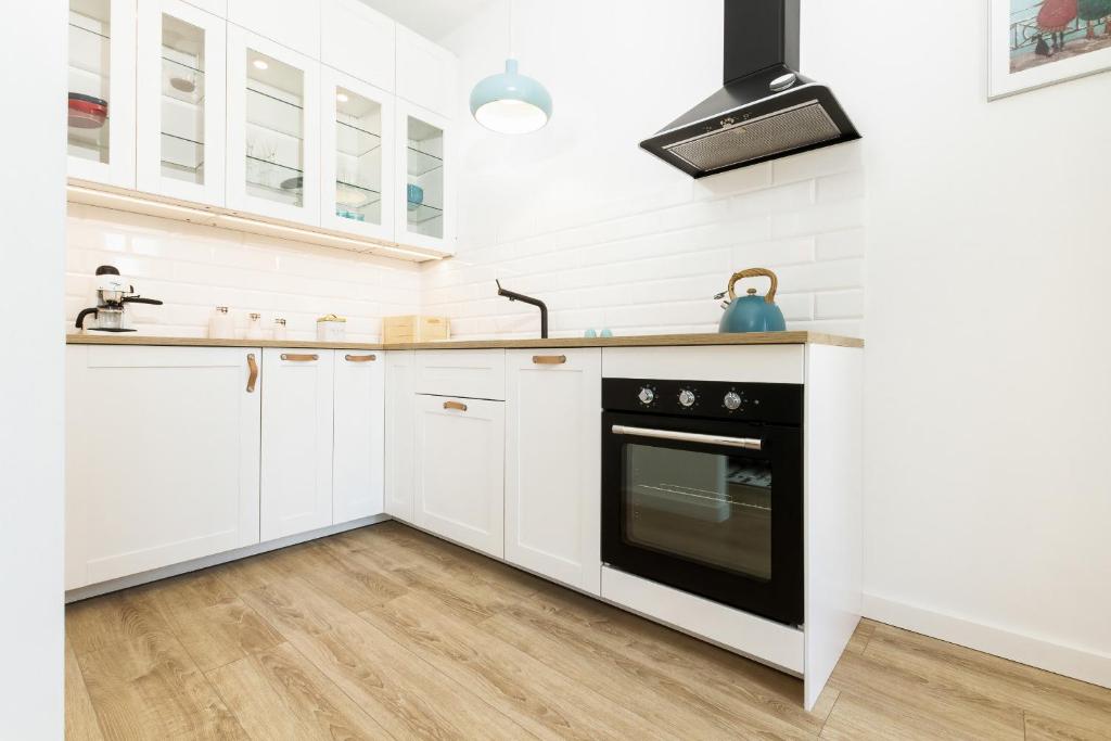 Kuchyňa alebo kuchynka v ubytovaní Apartments Zajezdnia Wrzeszcz Gdańsk Grudziądzka by Noclegi Renters