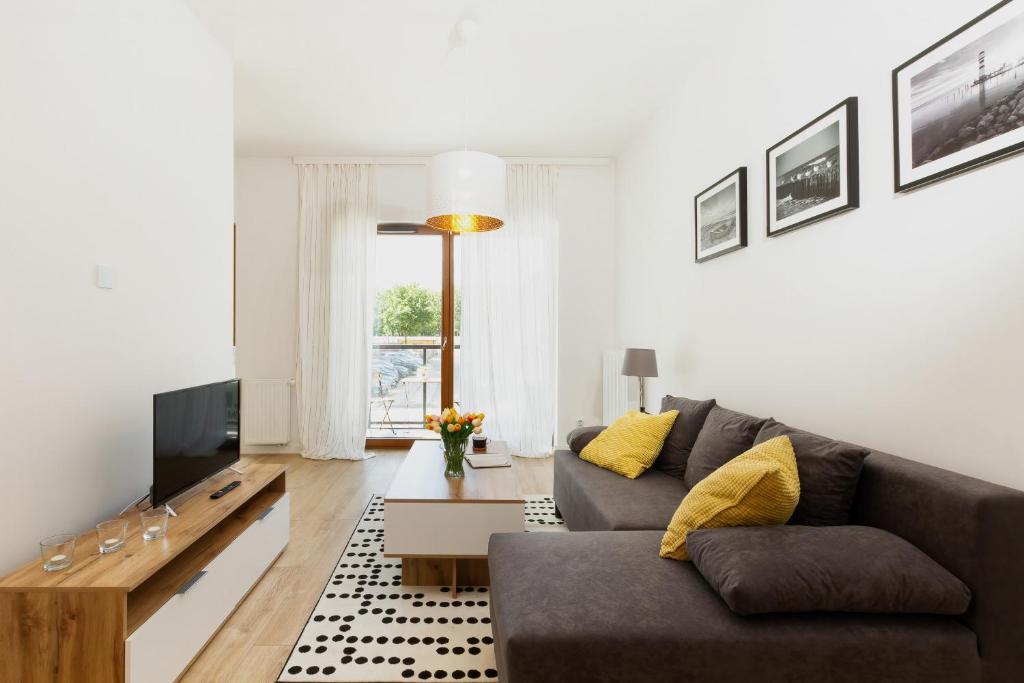 Televízia a/alebo spoločenská miestnosť v ubytovaní Apartments Zajezdnia Wrzeszcz Gdańsk Grudziądzka by Noclegi Renters